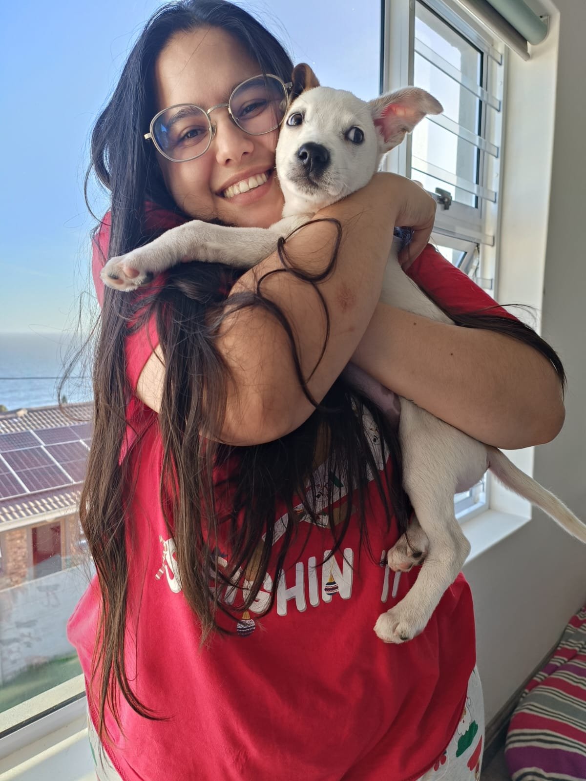 Tatyana cuddling a puppy